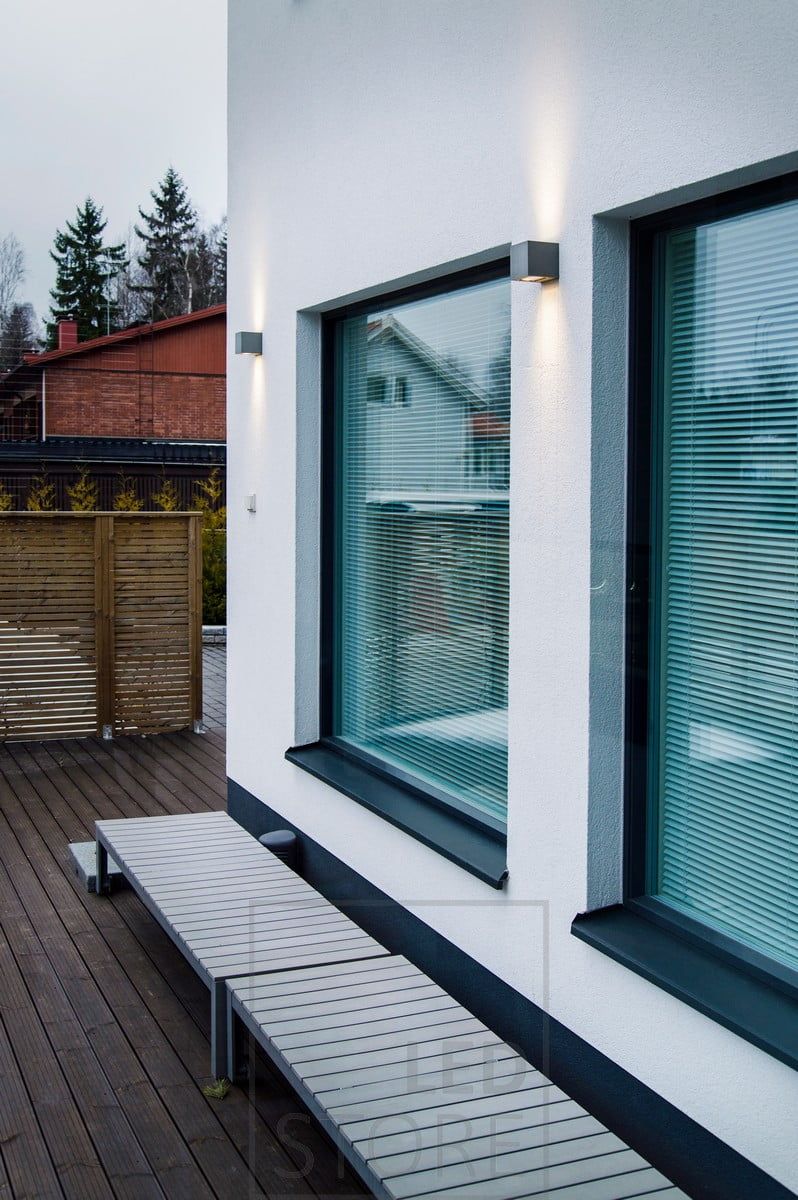 CUBIC OUT 2 outdoor luminaires between the windows, illuminating the façade in two directions. Ledstore.fi